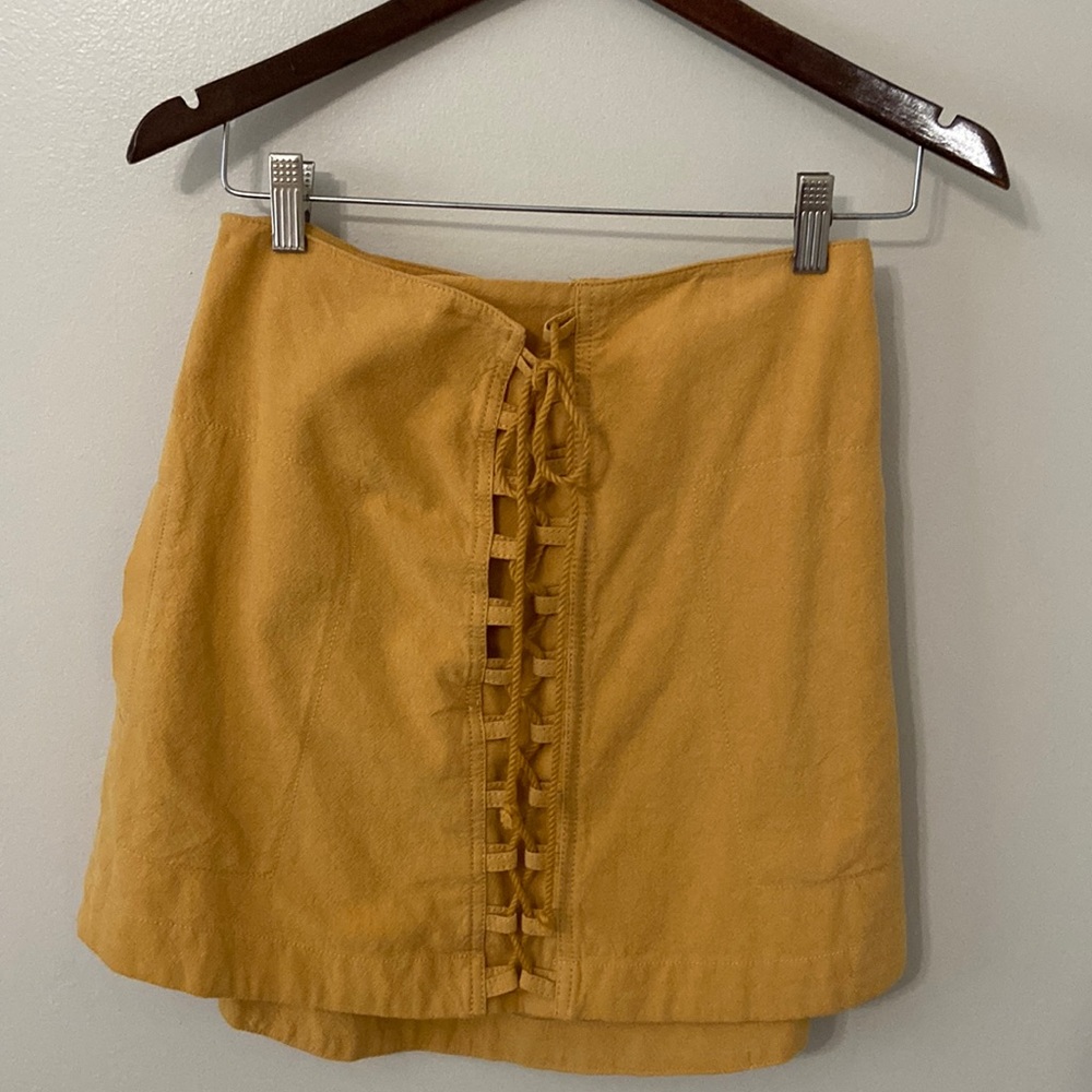 Free people miniskirt color is mustard: size S